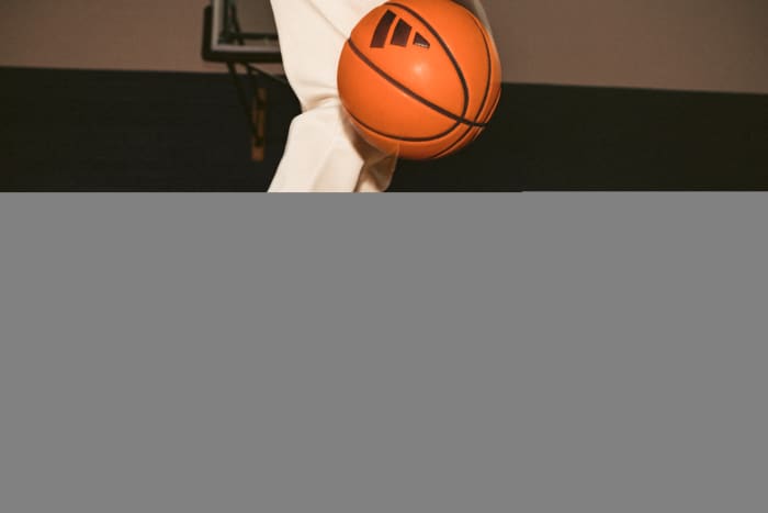 Side view of Candace Parker's champagne-colored adidas shoes.